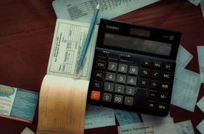 a calculator sitting on top of a wooden table